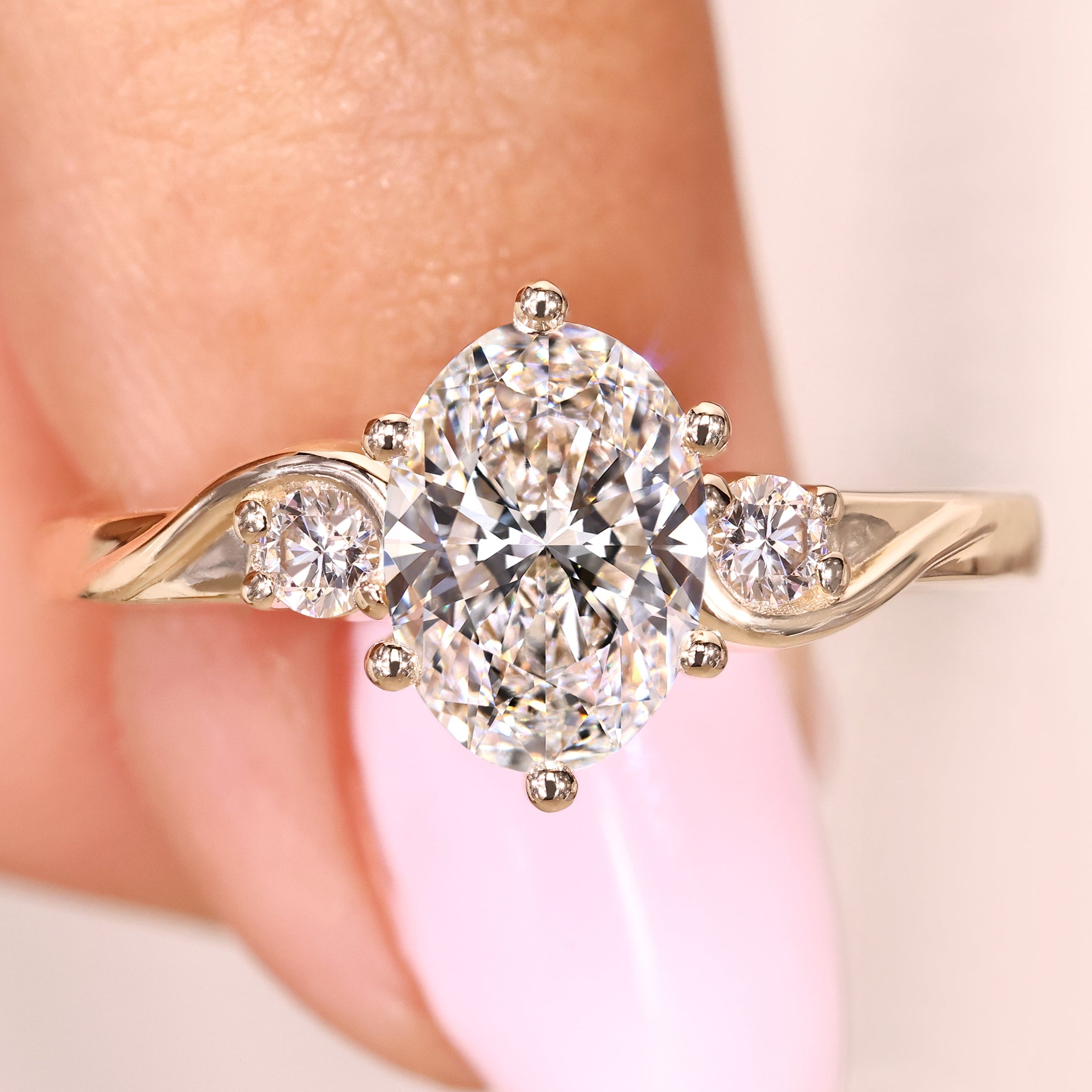 Oval cut lab grown diamond ring with round side stones
