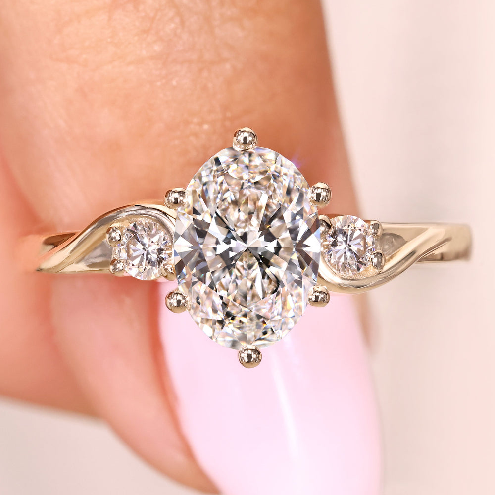 Oval cut lab grown diamond ring with round side stones
