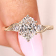 Oval cut lab grown diamond ring with round side stones
