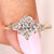 Oval cut lab grown diamond ring with round side stones
