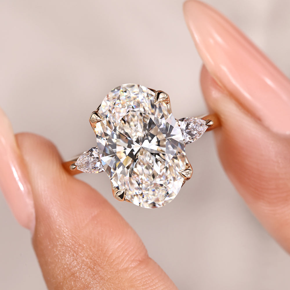 Handmade oval cut diamond three stone ring.
