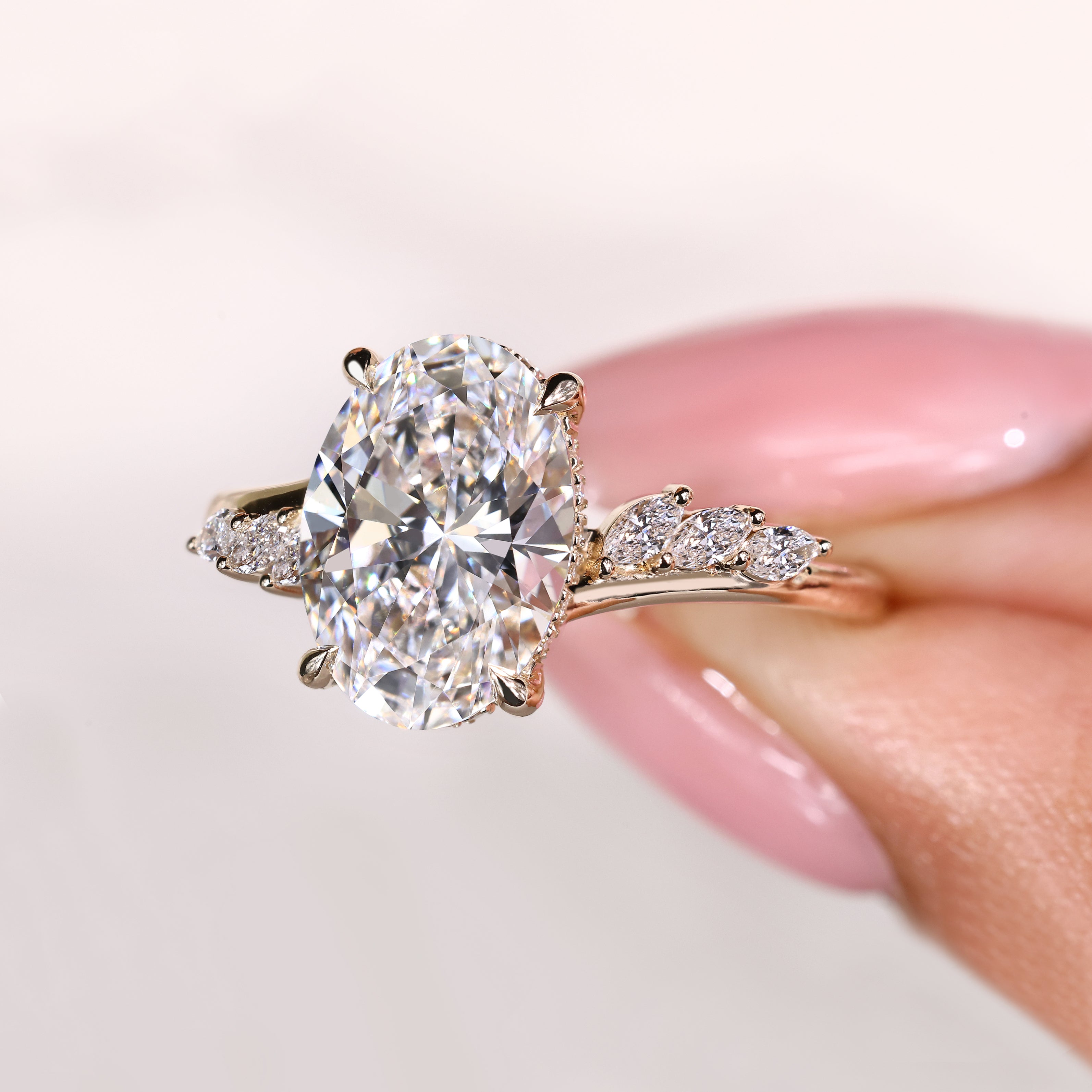 Oval cut ring with cathedral setting and hidden halo
