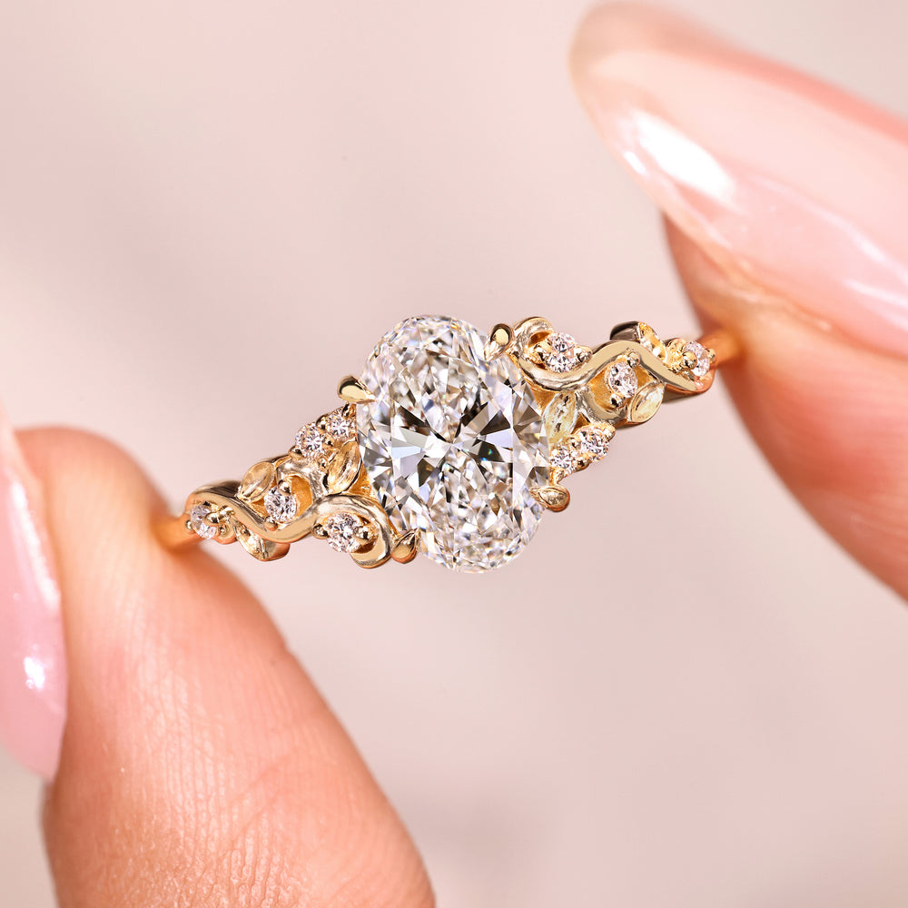 Lab grown diamond oval ring with side stones.
