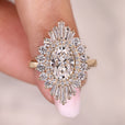Oval diamond engagement ring with double halo setting.