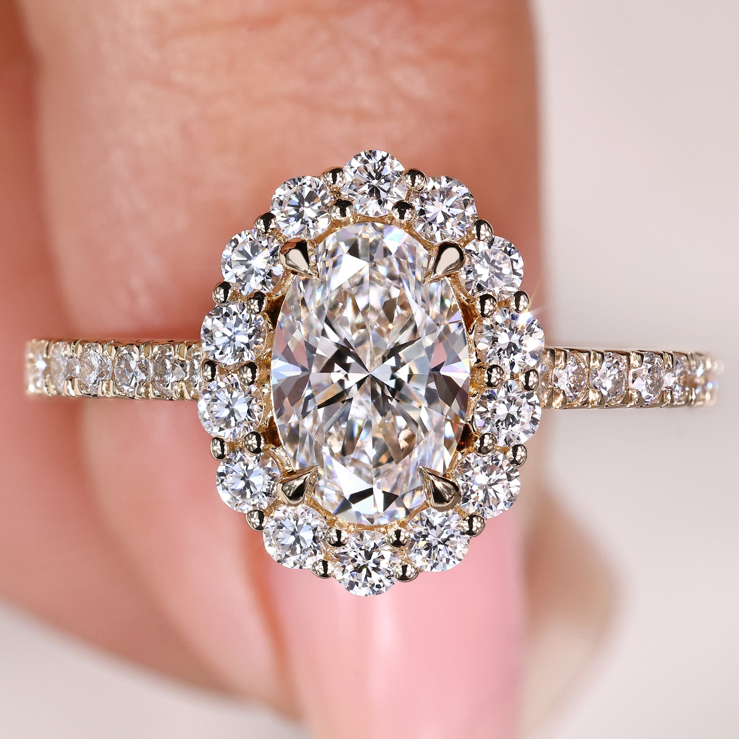 Oval diamond engagement ring with round halo and pave
