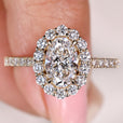 Oval diamond engagement ring with round halo and pave
