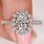 Oval diamond engagement ring with round halo and pave
