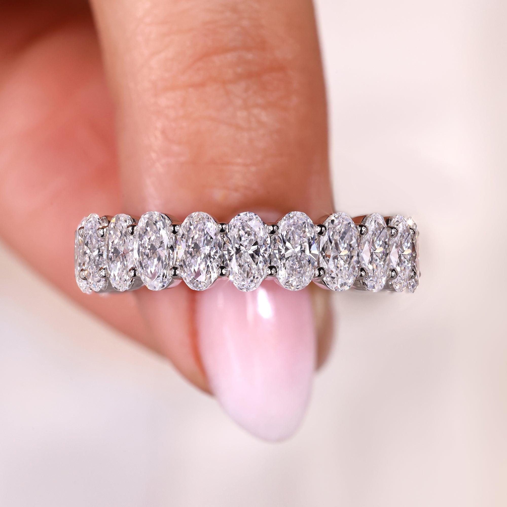 Oval diamond eternity band in white gold.