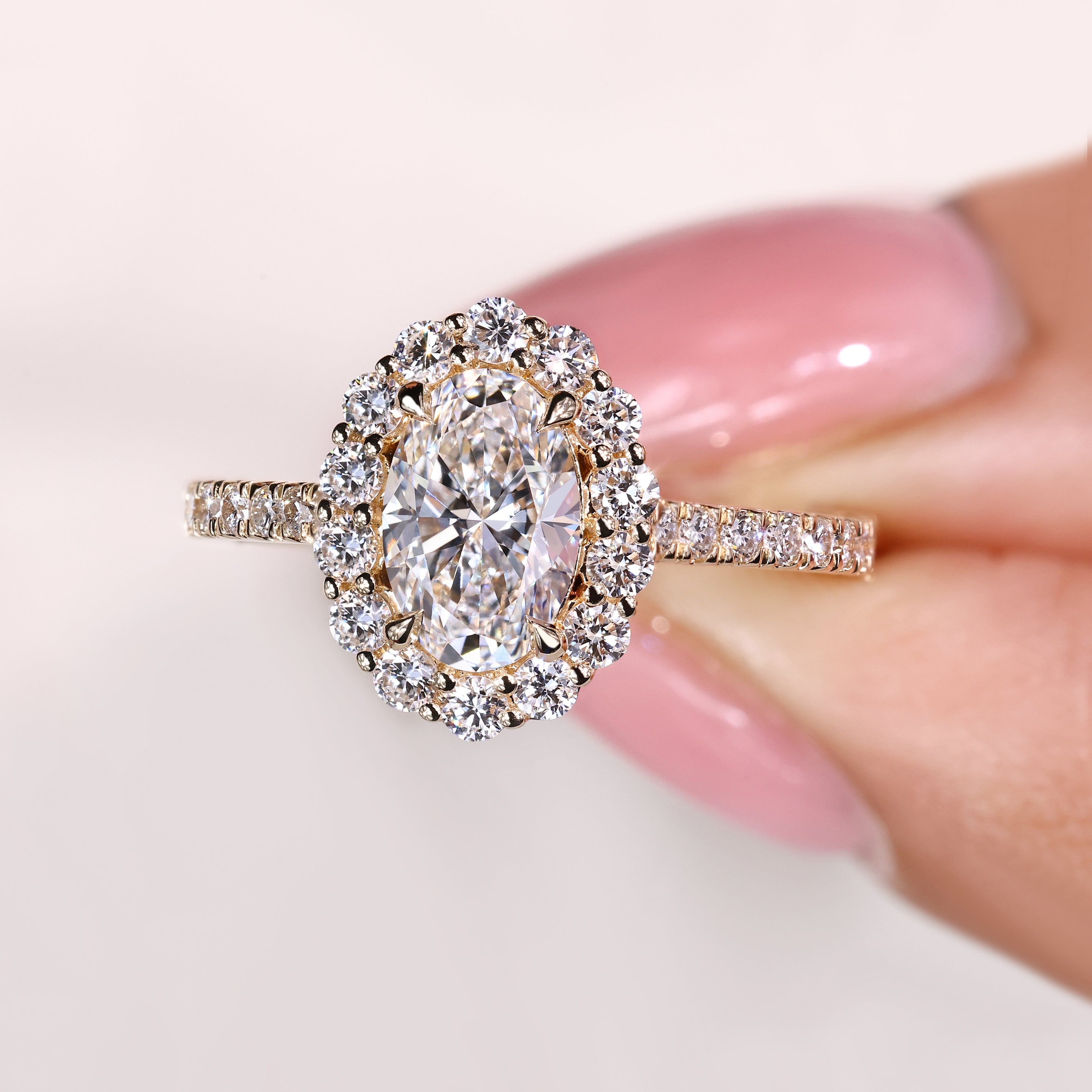 Four claw prong oval diamond ring with pave details

