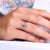 Oval diamond solitaire ring featuring a split shank design.