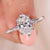 Solitaire oval diamond engagement ring with six claw prong in white gold.