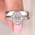 Oval Engagement Ring With Wedding Band in white gold.