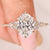 Oval engagement ring with kite and round side stones
