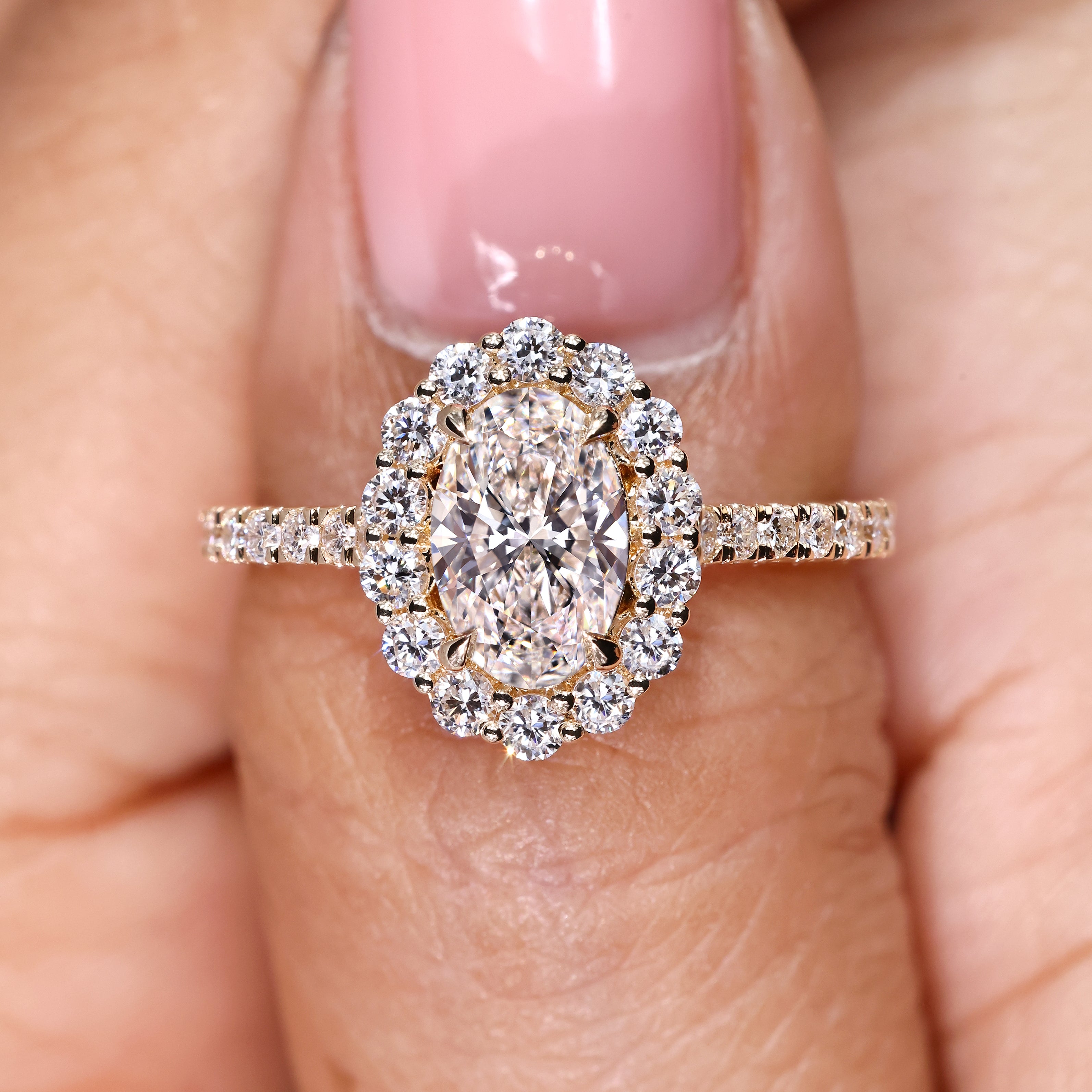 Handmade oval ring with pave and cathedral setting details
