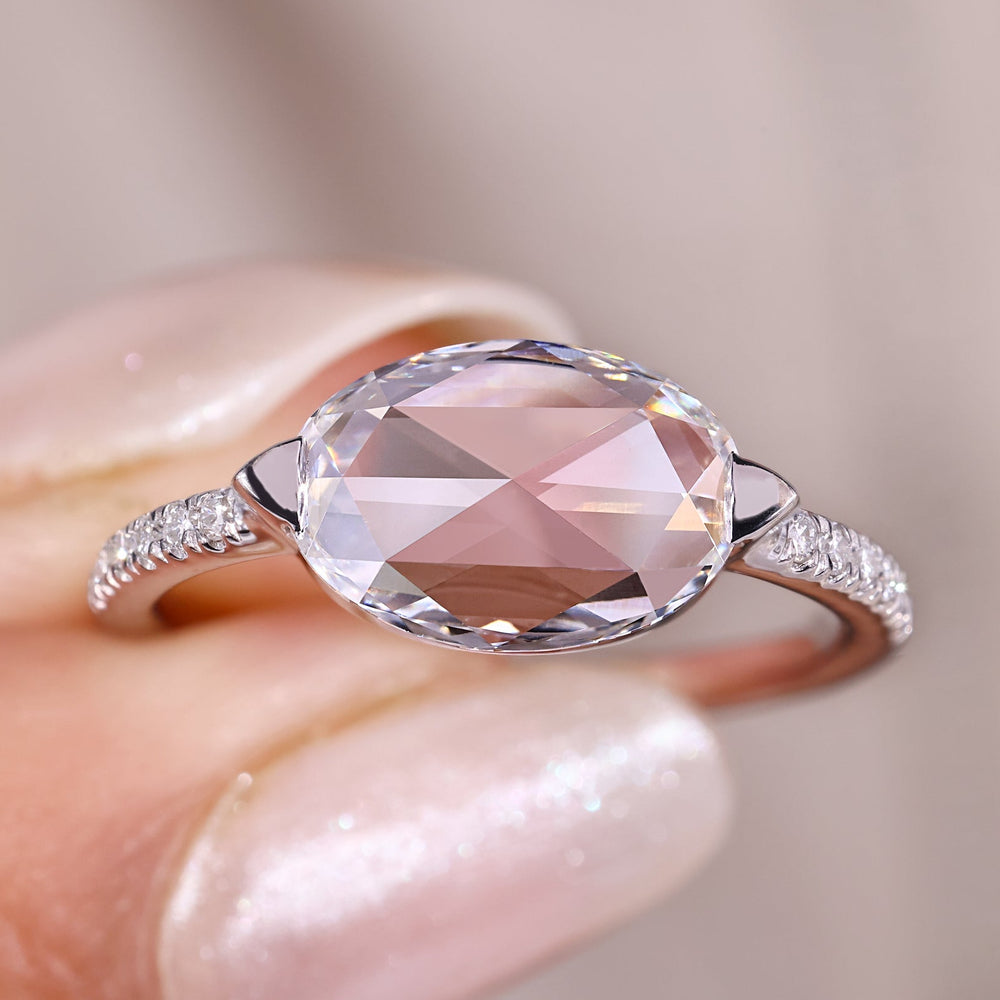 Oval rose cut engagement ring set in white gold.