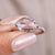Oval rose cut engagement ring set in white gold.