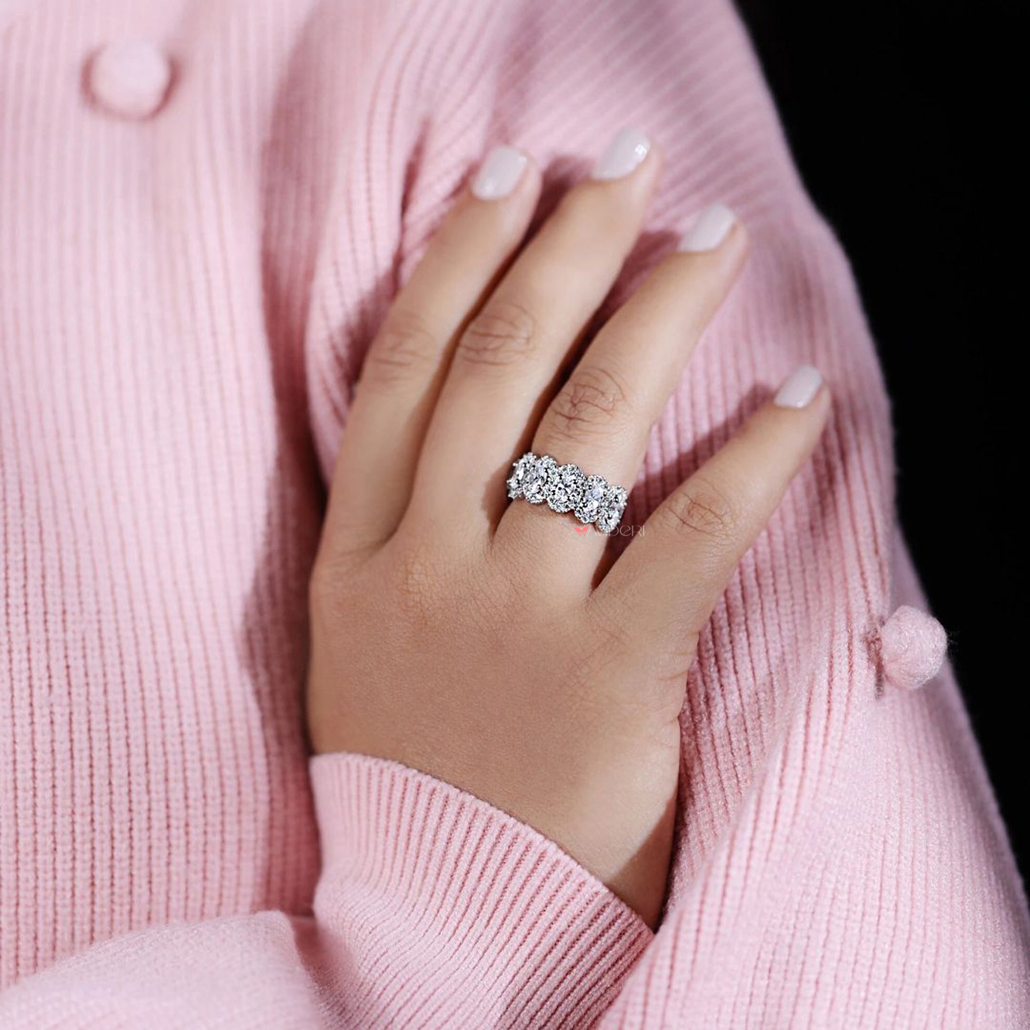 Handmade moissanite oval wedding band seven stone style.