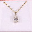 Oval solitaire pendant with 4 claw prong setting in yellow gold.