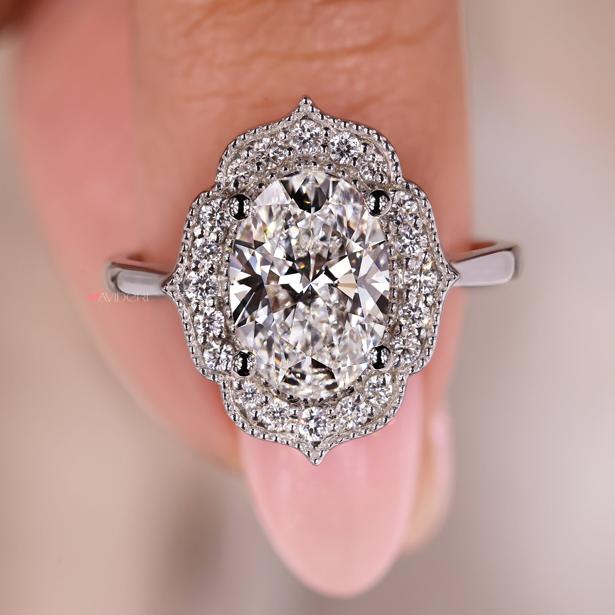 Buy an engagement ring in white gold with a halo setting for elegance.