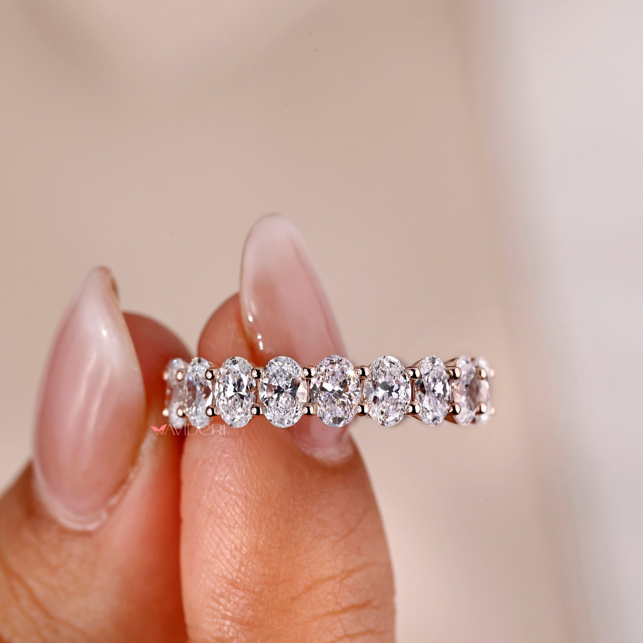 Exquisite oval diamond wedding ring from Avideri, featuring a full eternity design with a brilliant cut.
