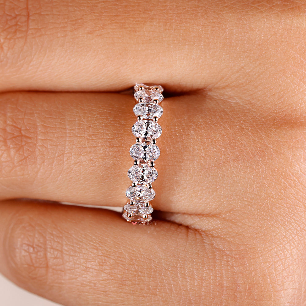 Chic oval diamond band crafted with lab grown diamonds for a modern and ethical choice.
