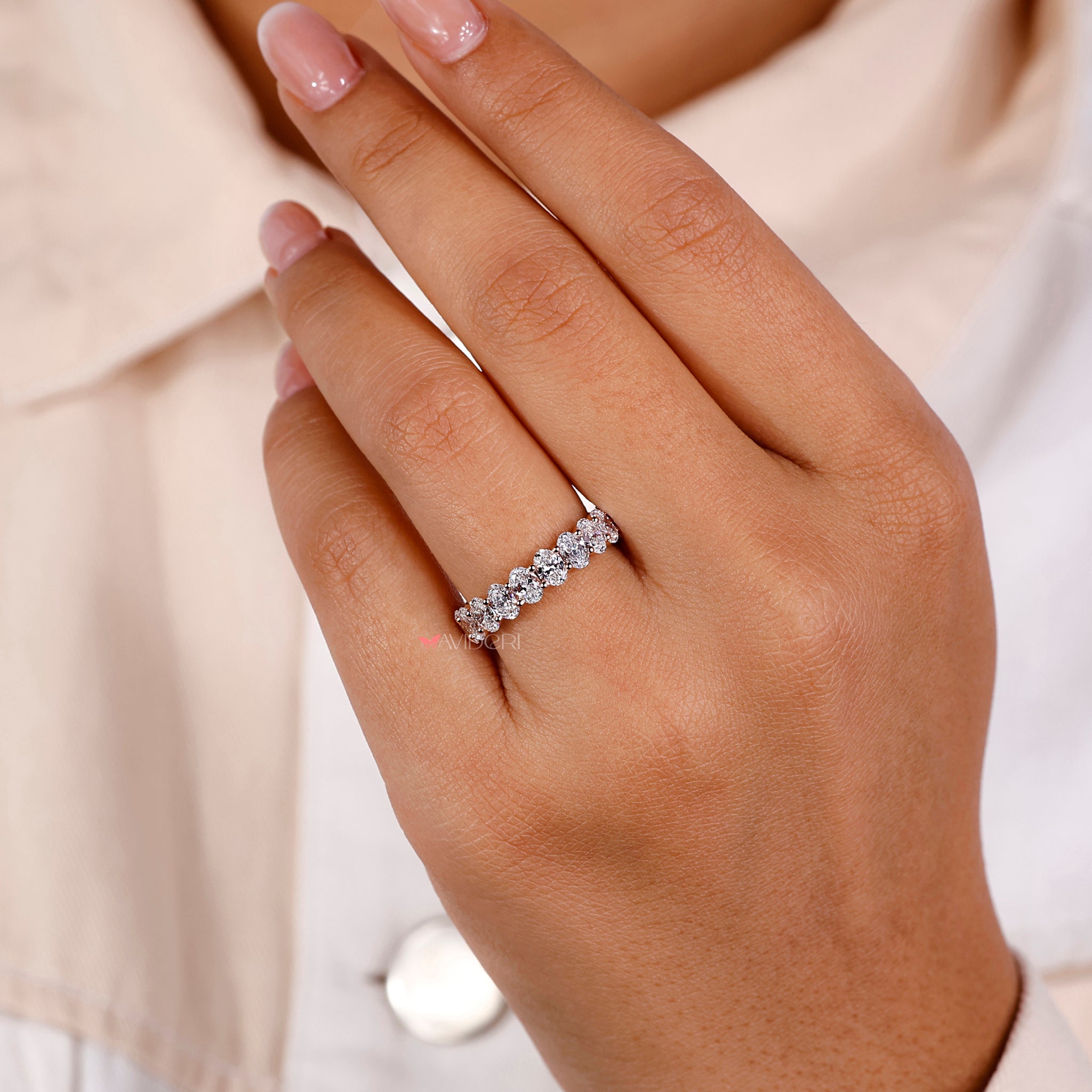 Oval diamond ring with diamond band featuring a full eternity design for a luxurious finish.
