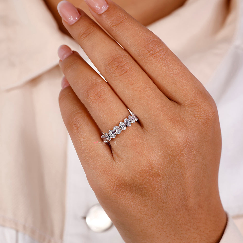 Oval diamond ring with diamond band featuring a full eternity design for a luxurious finish.
