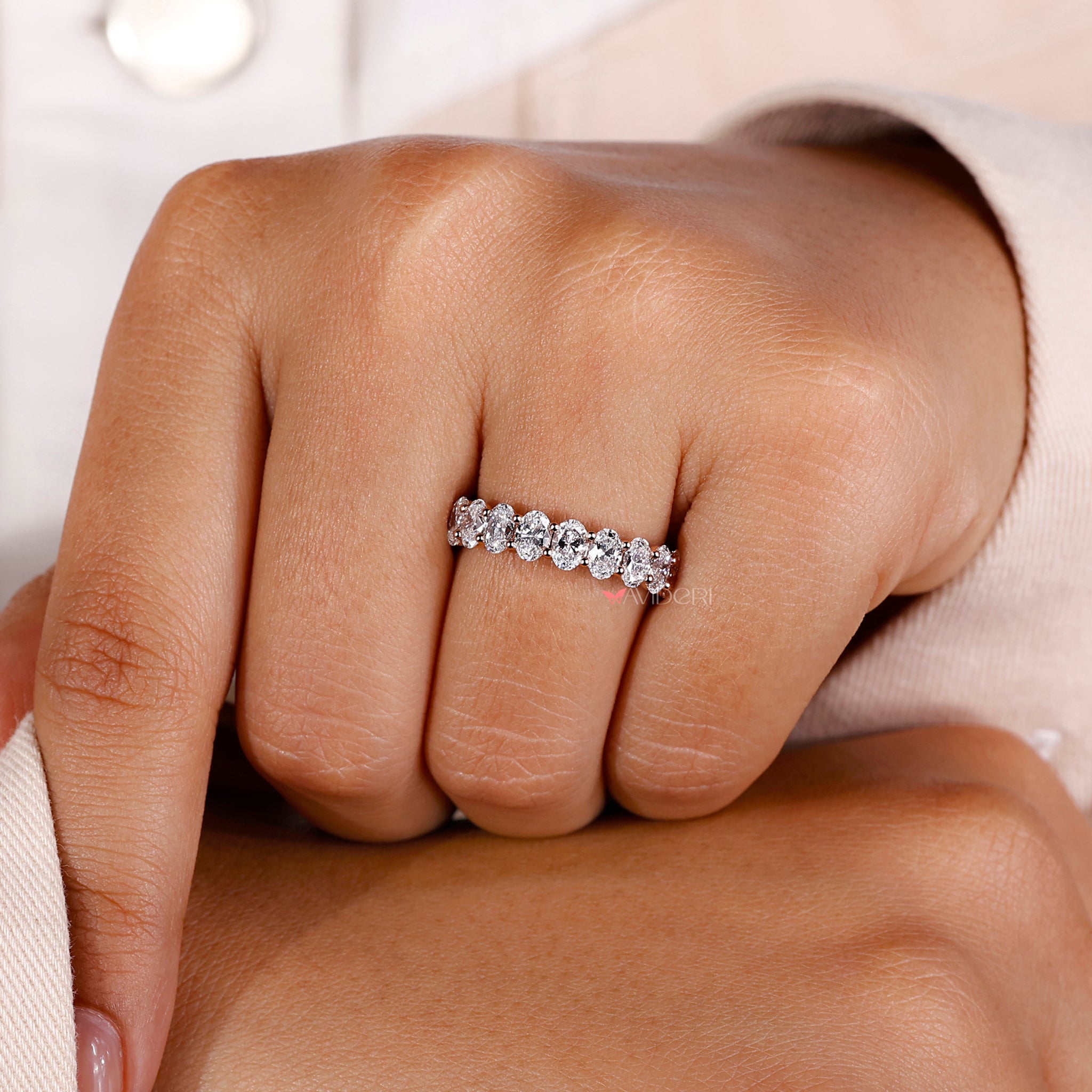 Dazzling oval eternity wedding band featuring IGI certified diamonds and handmade jewelry craftsmanship.
