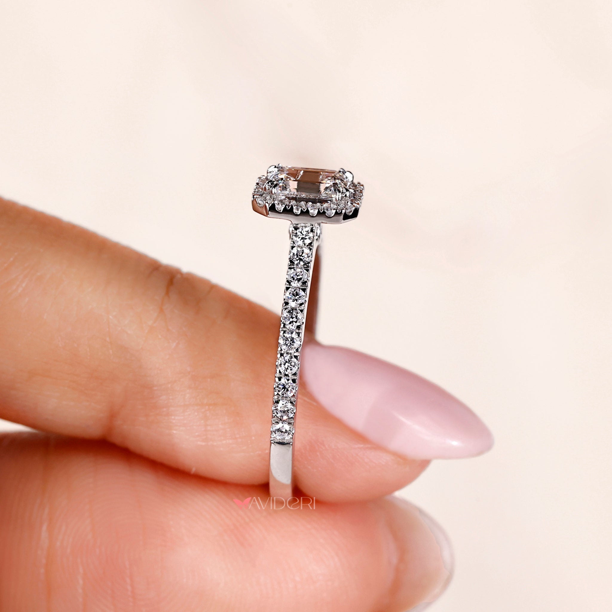 Halo diamond ring with a pave band.
