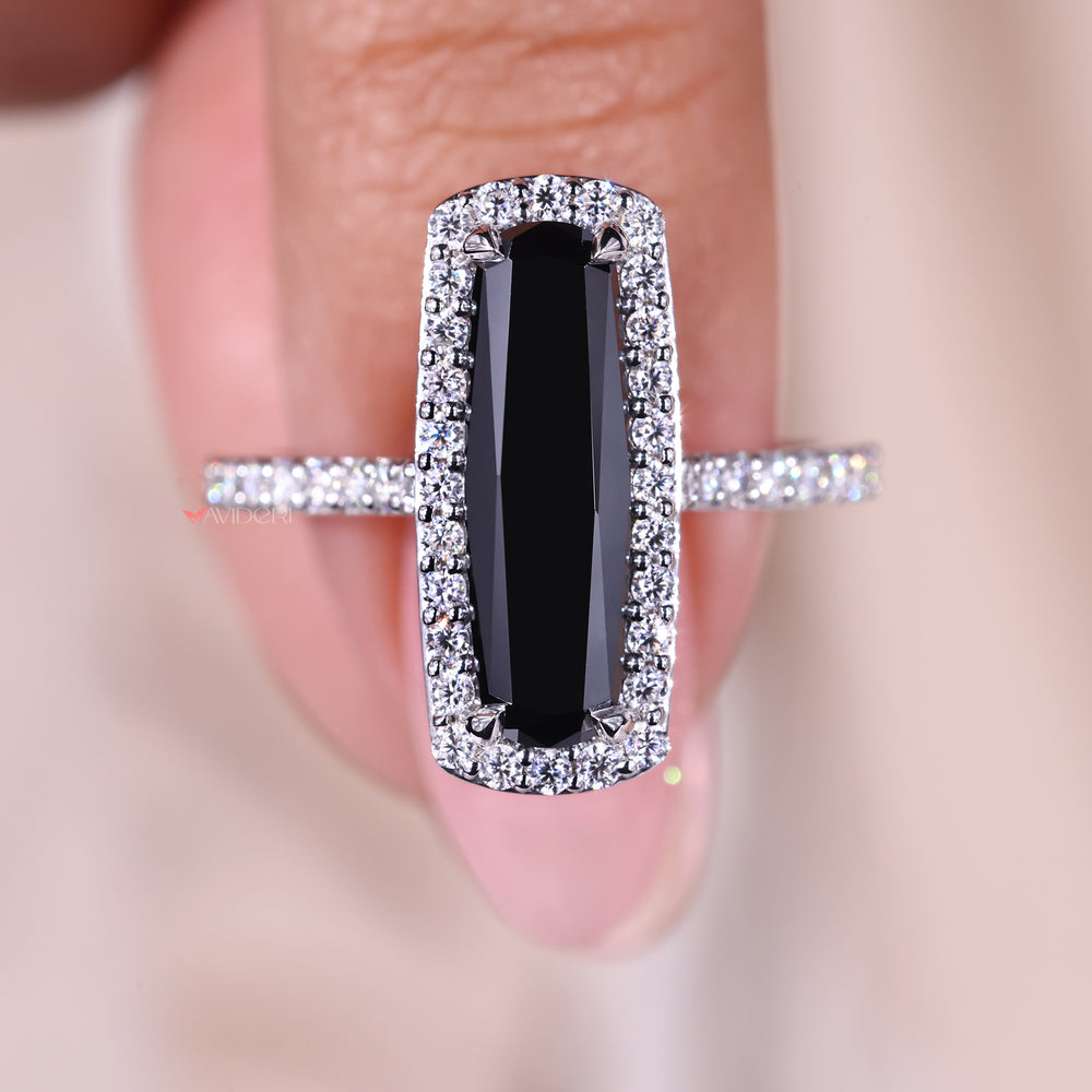 Round cut halo engagement ring with a black stone for a bold contrast.
