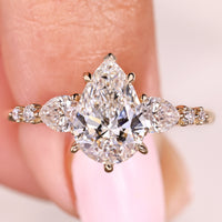 Pear Cut Diamond Ring With Side Stone Style