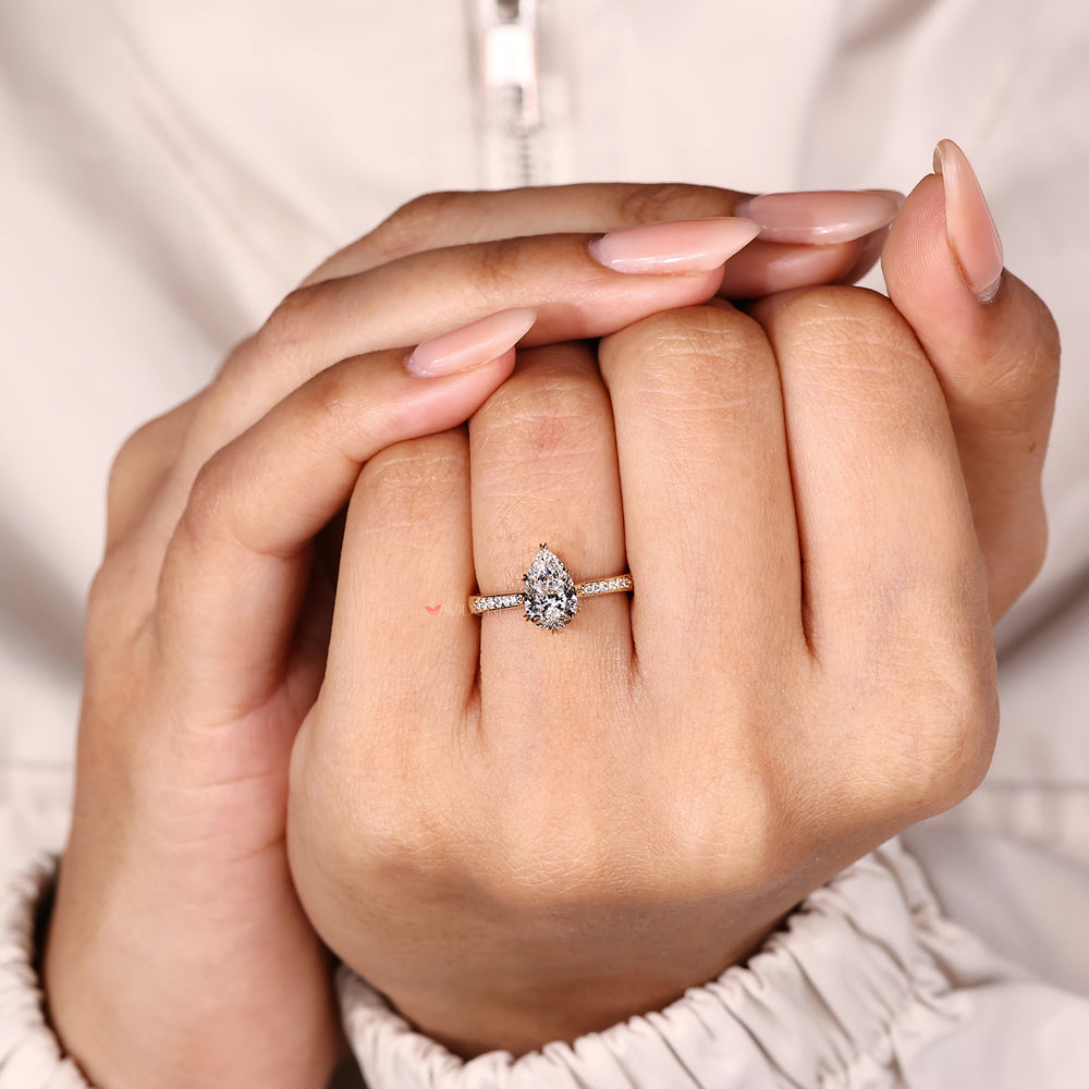 Elegant pear cut diamond engagement ring design.
