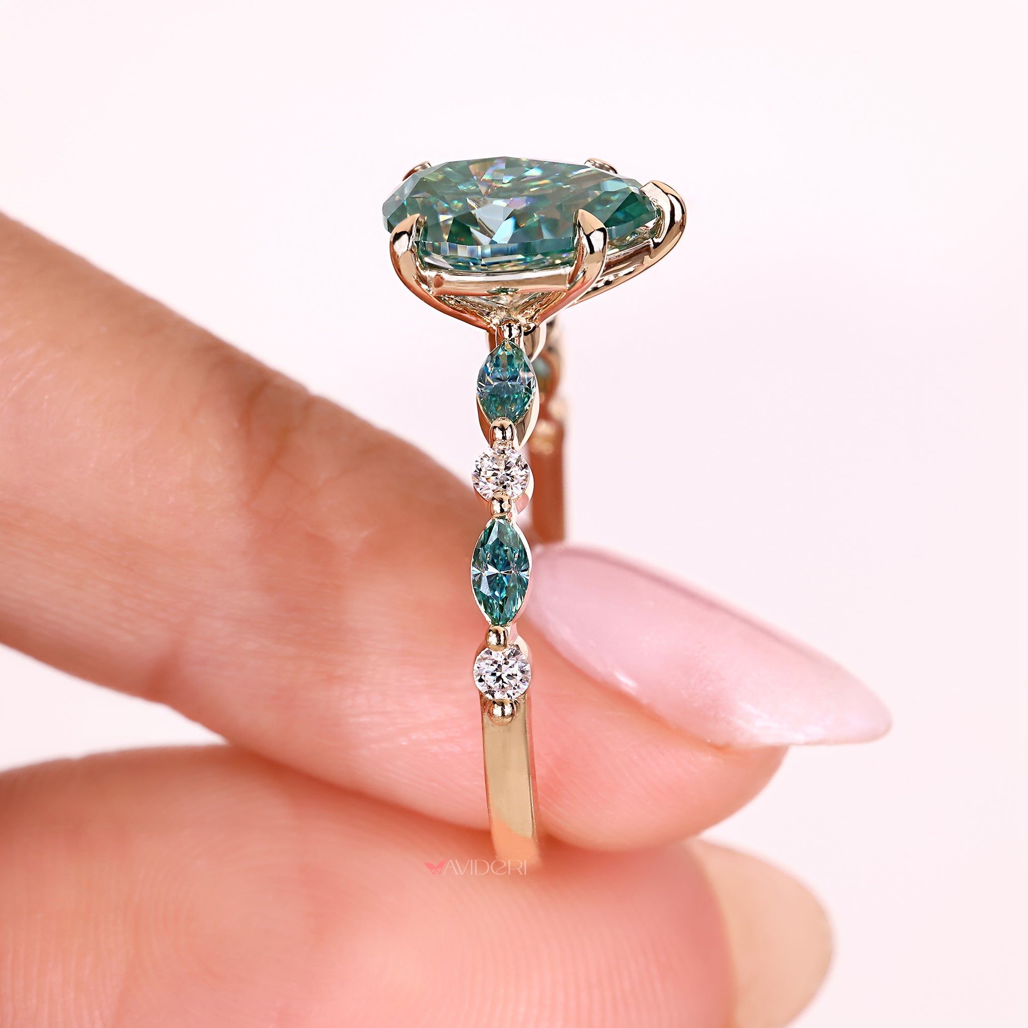 Pear cut ring with marquise and round stones.
