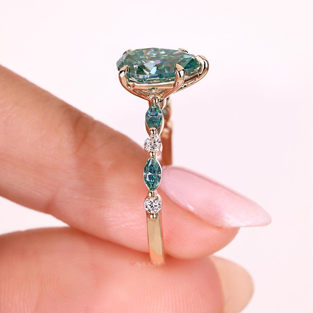 Pear cut ring with marquise and round stones.
