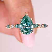 Cyan Blue Pear Cut Moissanite Ring with Marquise And Round Side Stones