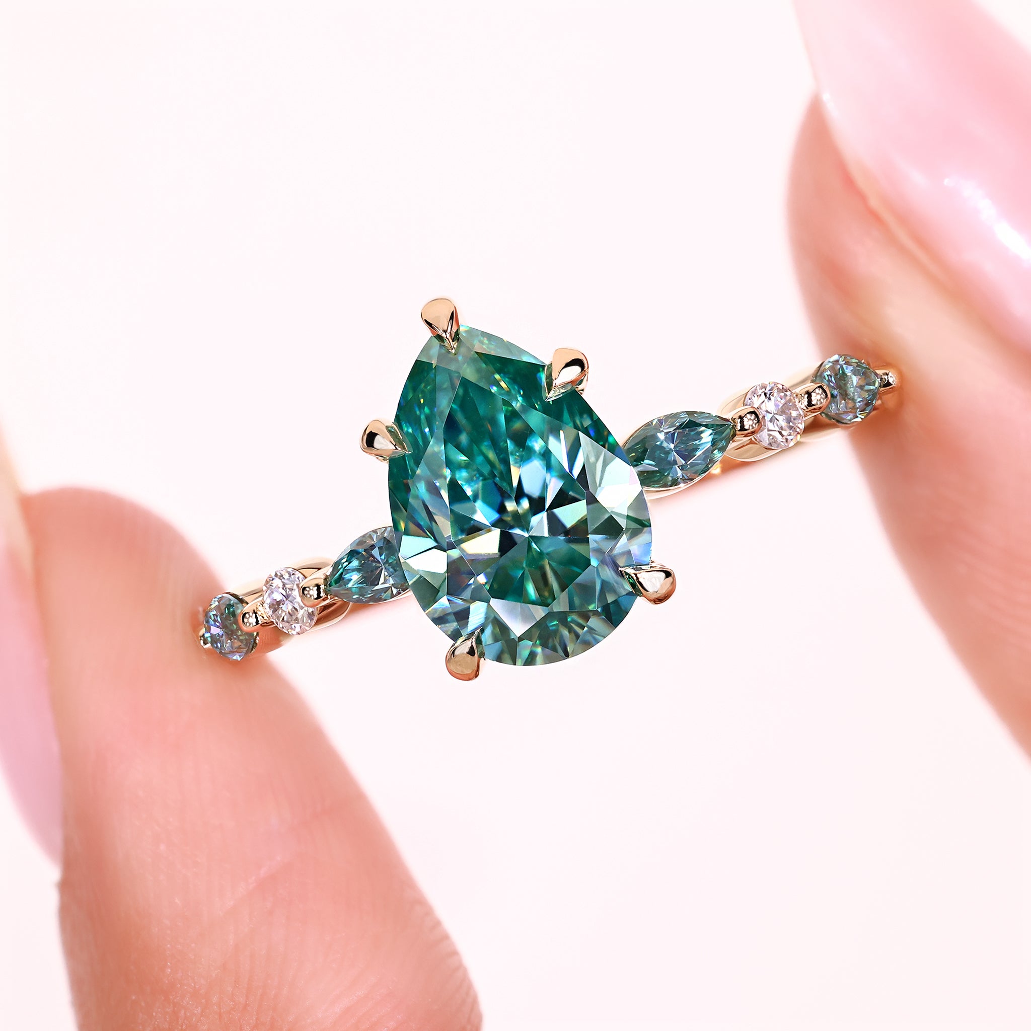 Pear moissanite ring five claw prong setting.
