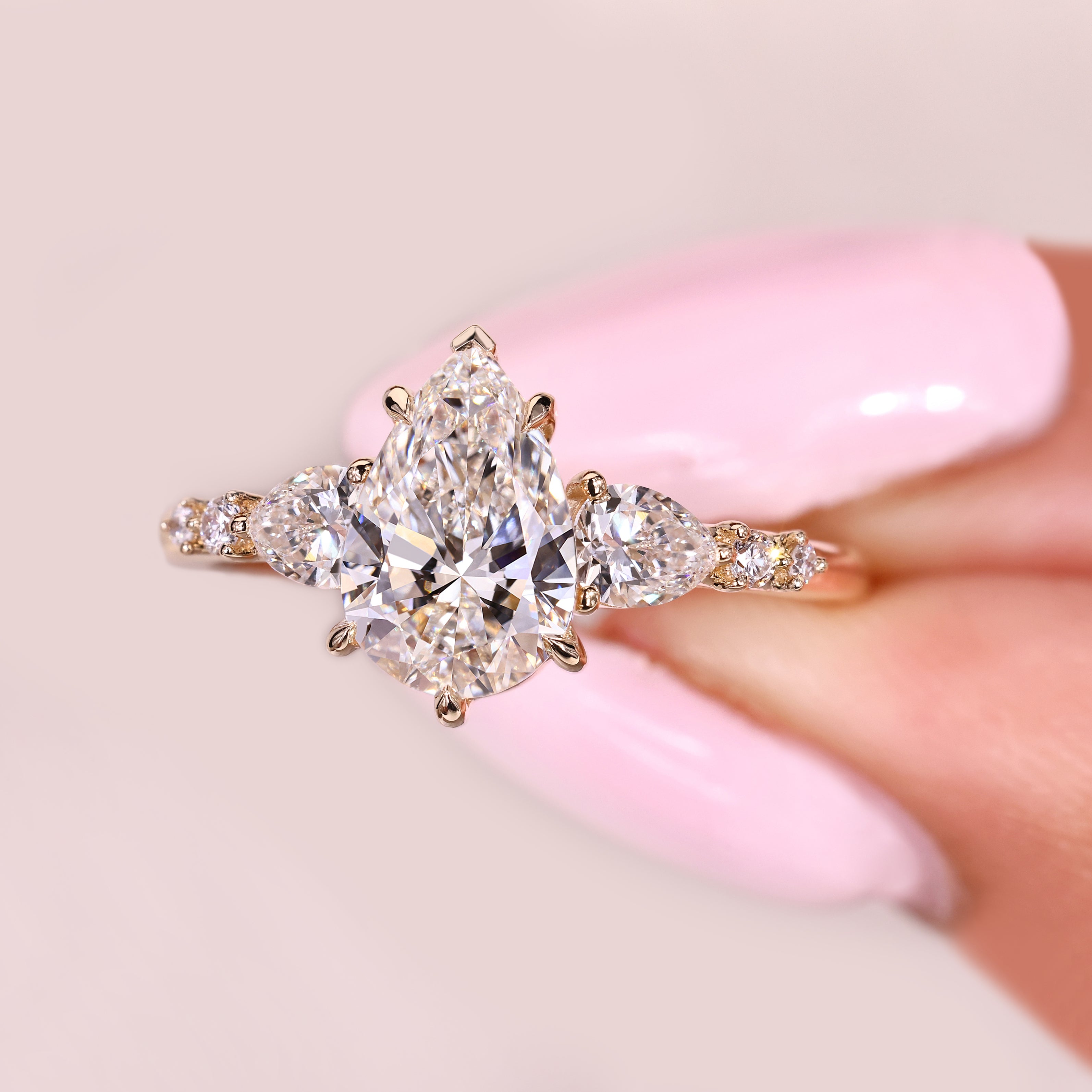 Lab grown pear diamond ring with basket setting design
