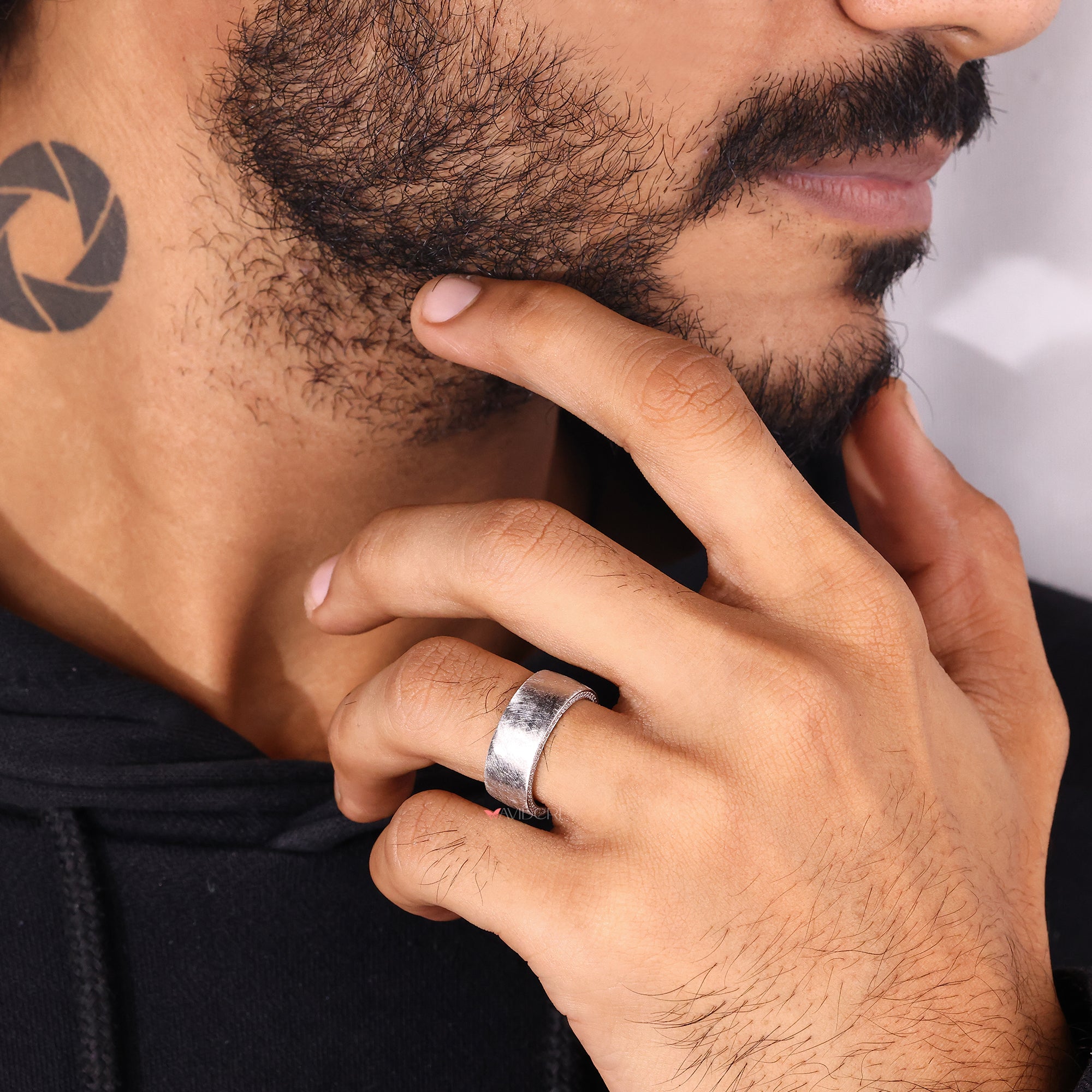 Wide brush finish men’s eternity band.