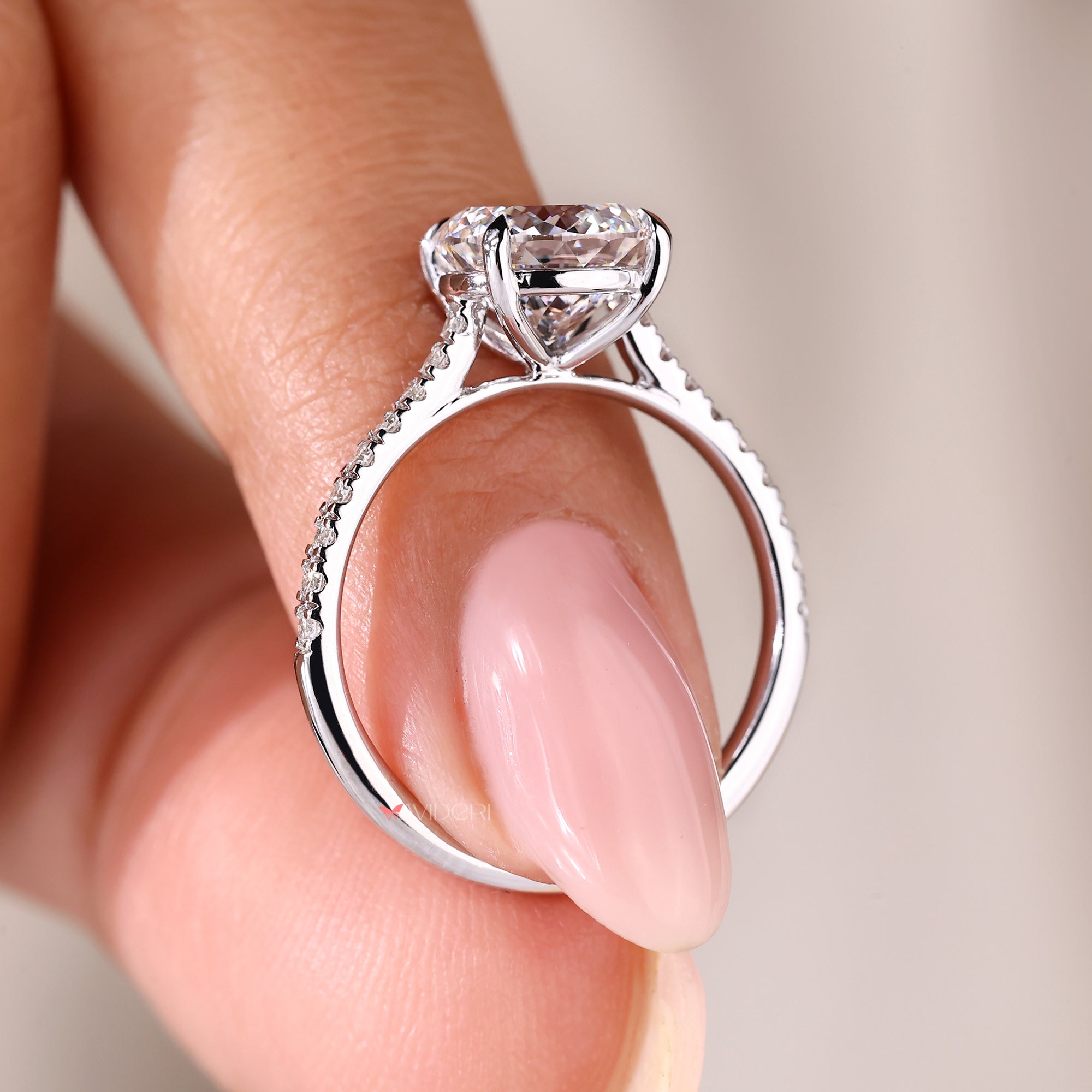 Cathedral setting engagement ring with claw prongs.