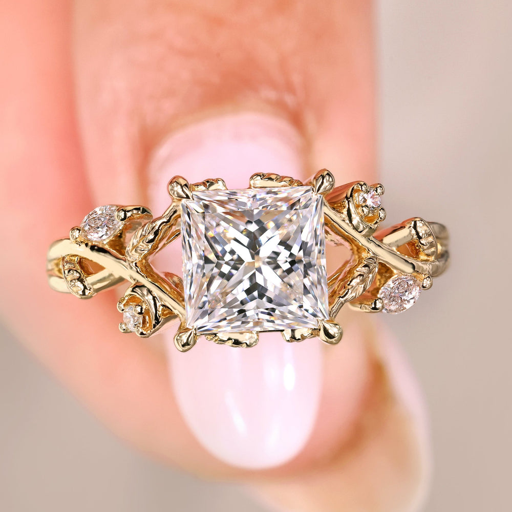 Princess cut diamond ring with marquise side stones.
