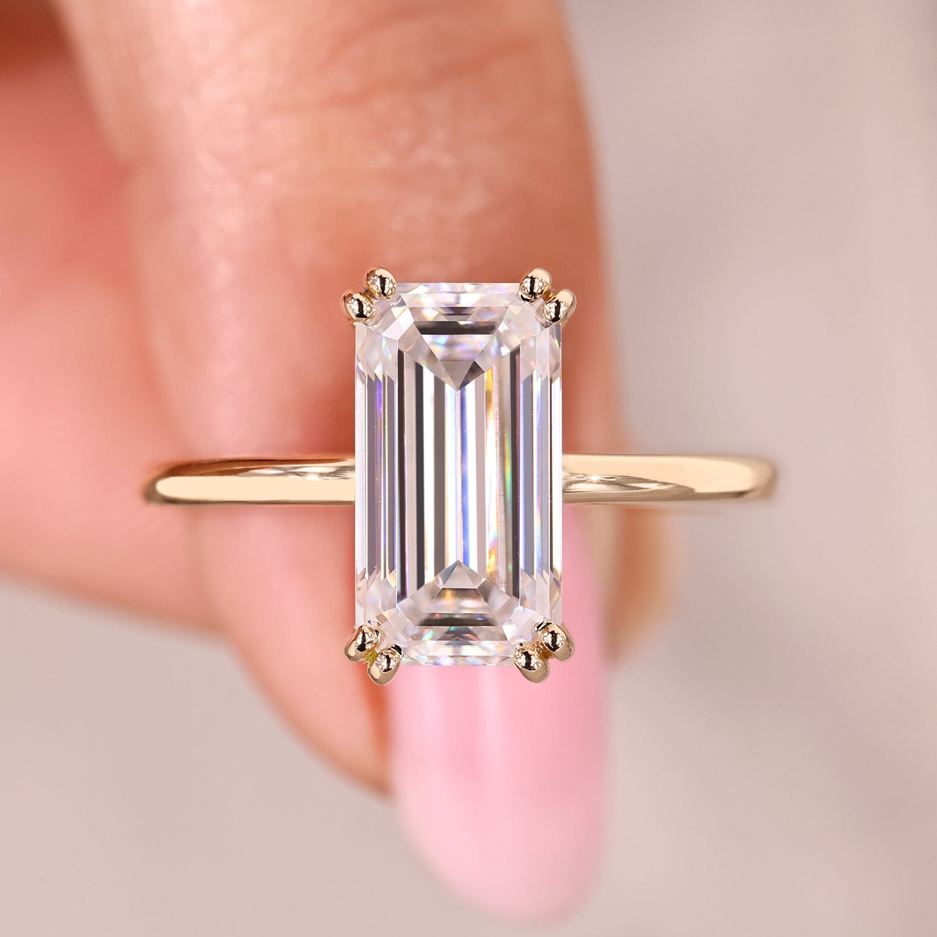Emerald cut moissanite engagement ring solitaire.
