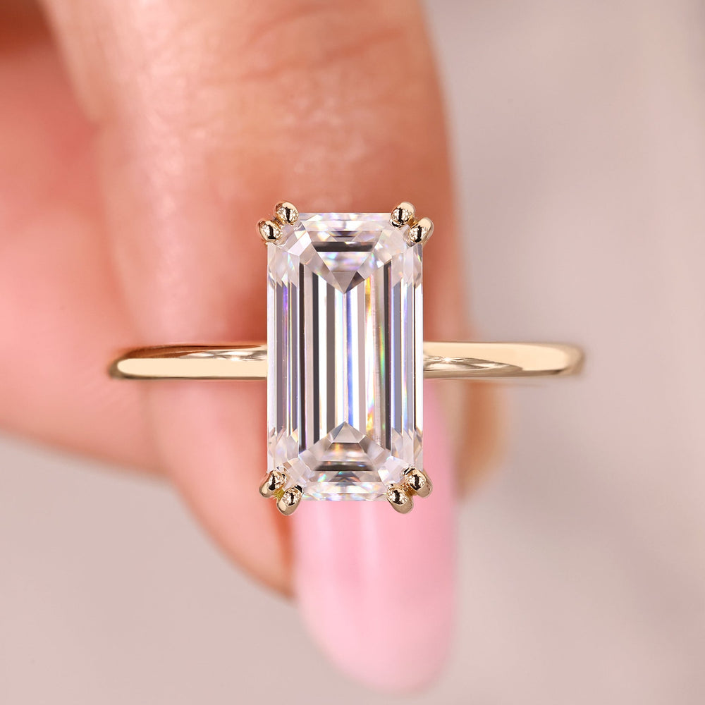 Emerald cut moissanite engagement ring solitaire.
