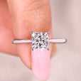 Princess cut diamond ring with solitaire style design.
