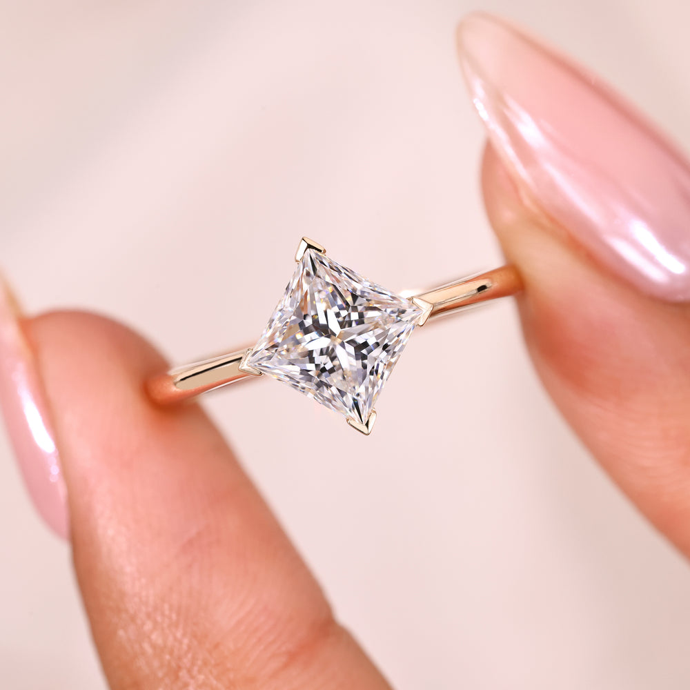 Princess diamond ring with v prong setting style.
