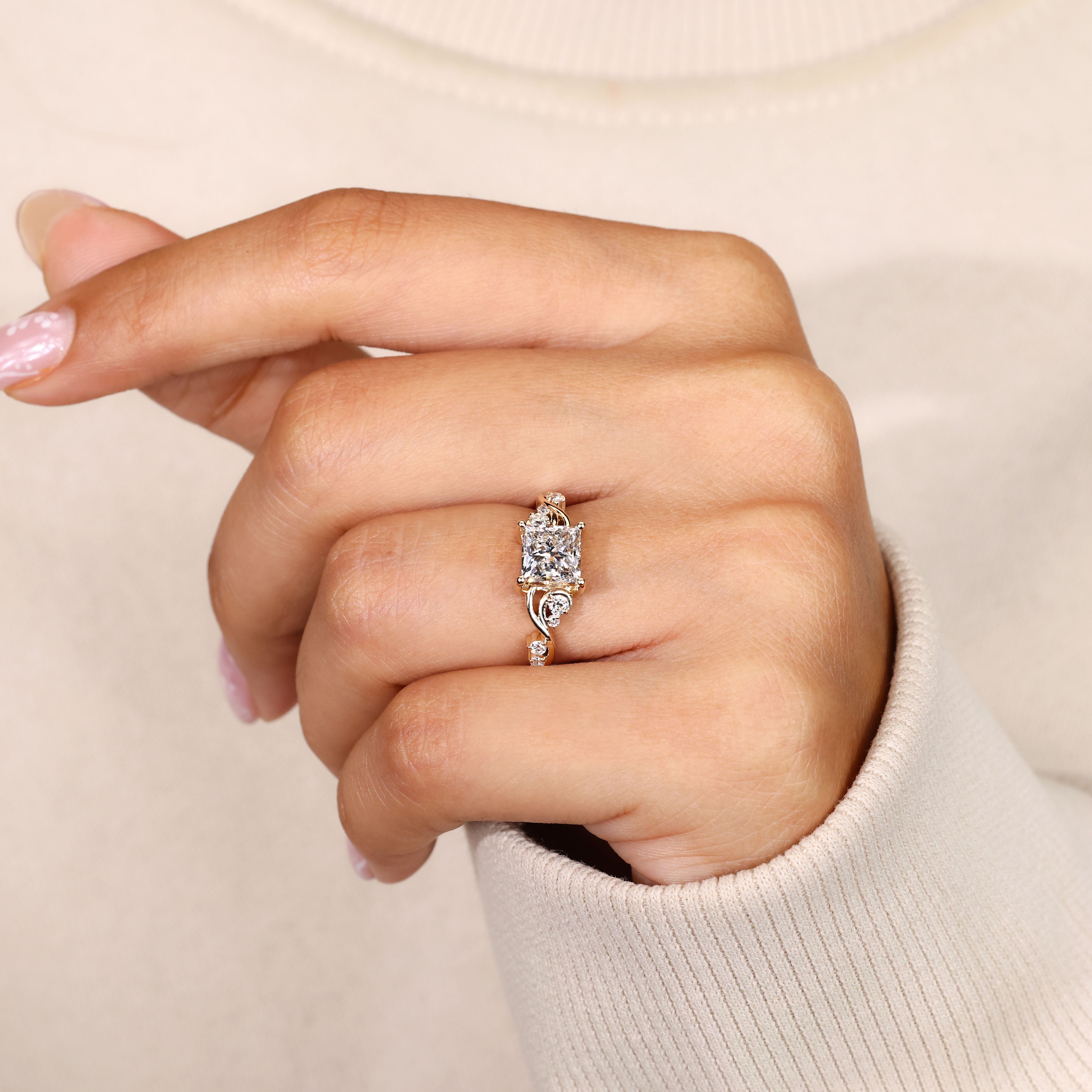 Princess cut diamond ring with twisted vine shank.

