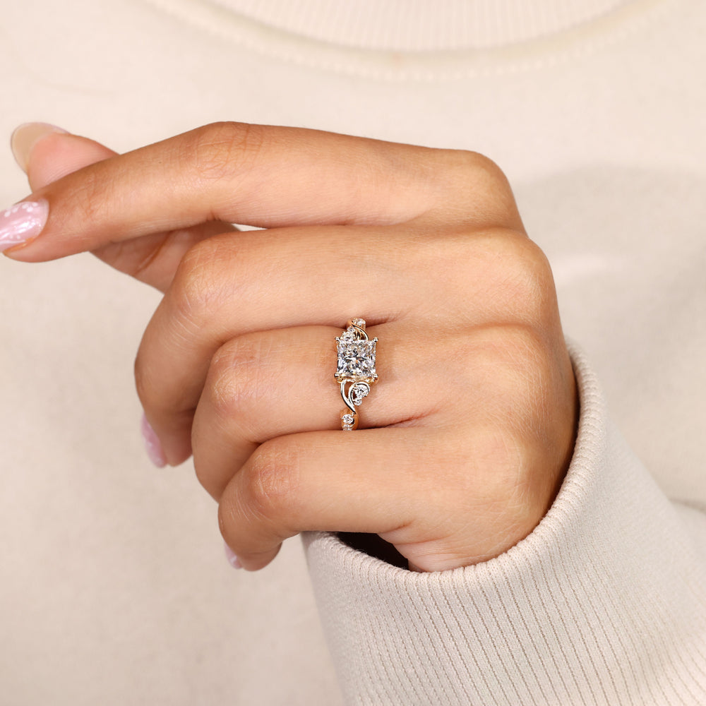 Princess cut diamond ring with twisted vine shank.
