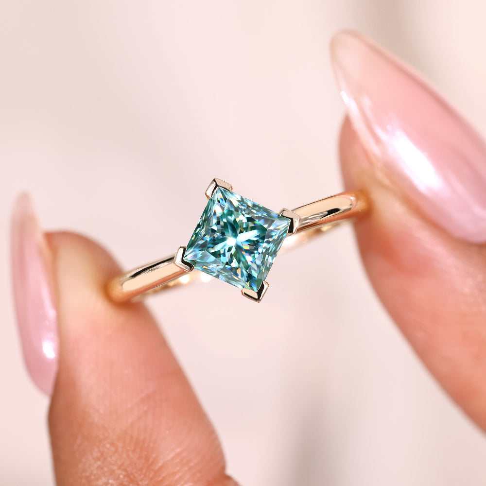 Princess ring with four v prong moissanite.
