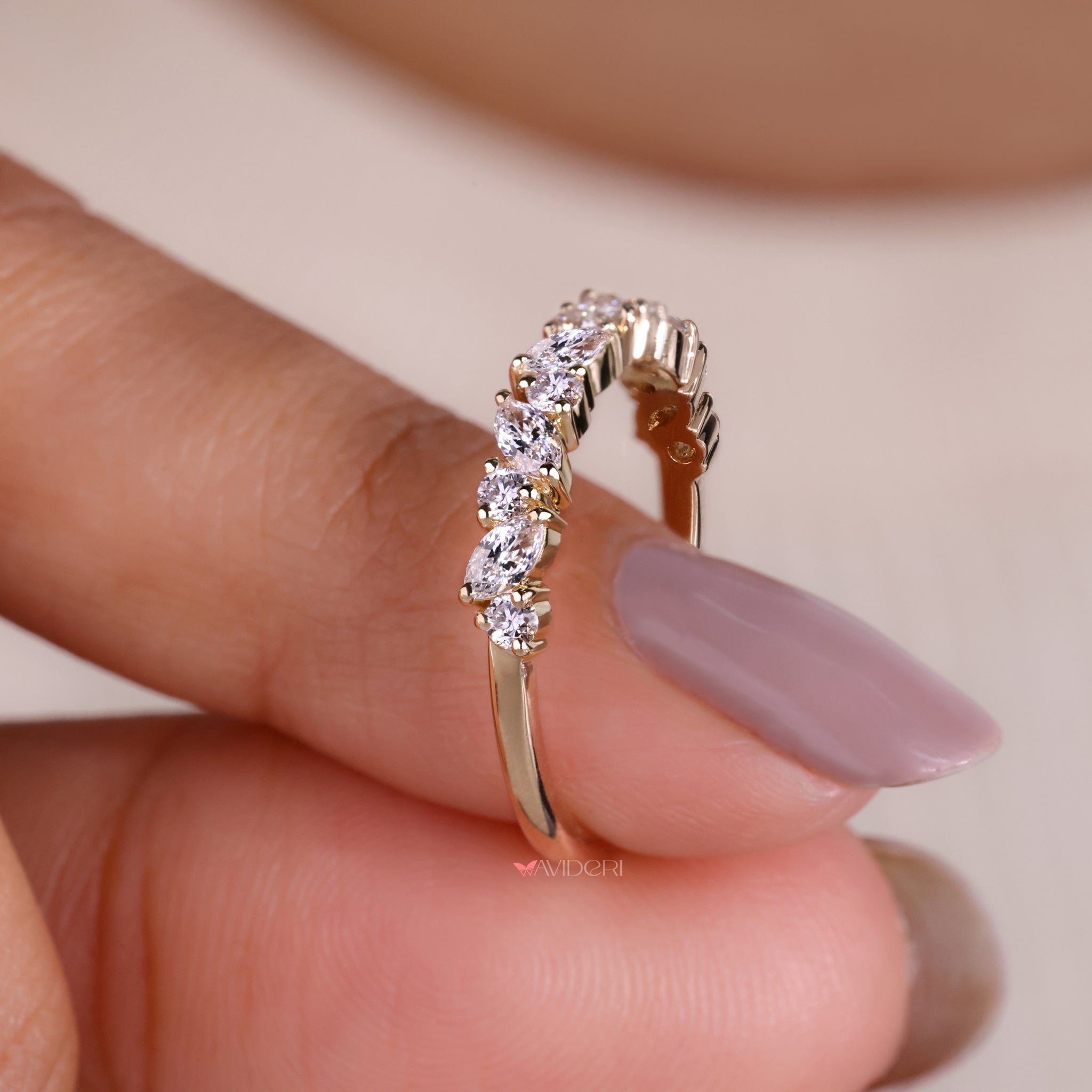 Half eternity band featuring a marquise wedding band for a classic design.
