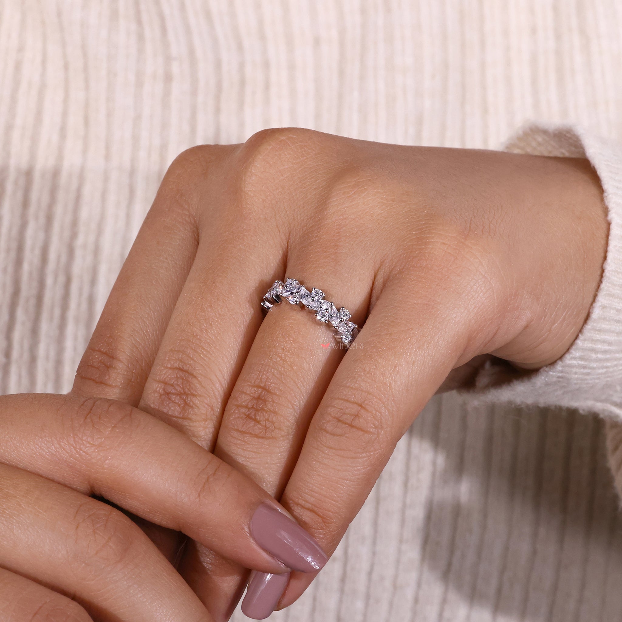 Prong setting band highlighting each diamond beautifully.
