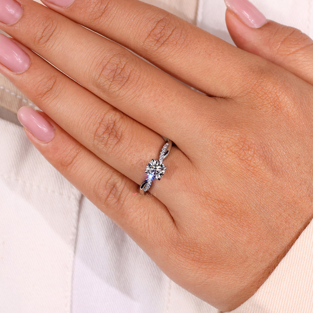 Round diamond ring showcasing brilliant sparkle in a white gold band.
